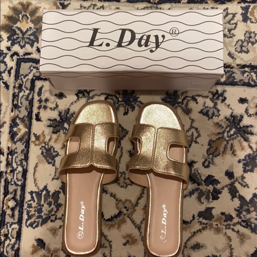 Gold sandals never worn- too small on me
